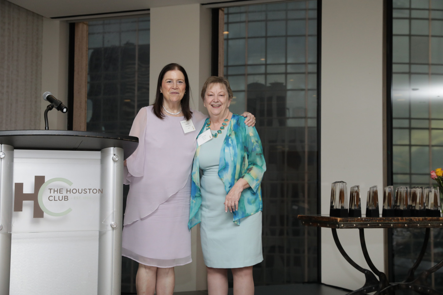 Carole Minor accepts recognition from Alice Brink